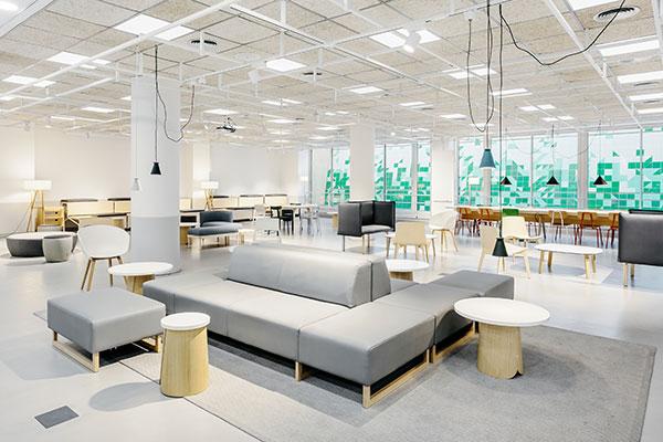Open collaborative workspace at UPF Barcelona School of Management with lounge seating and study areas.